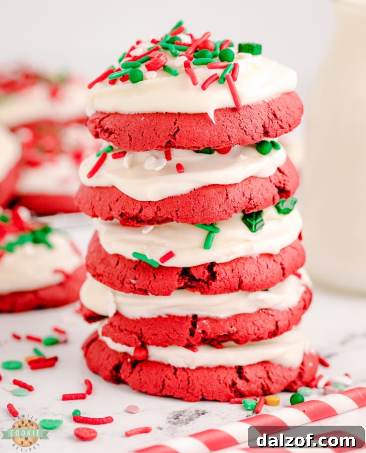 stack of red velvet cookies with Christmas sprinkles