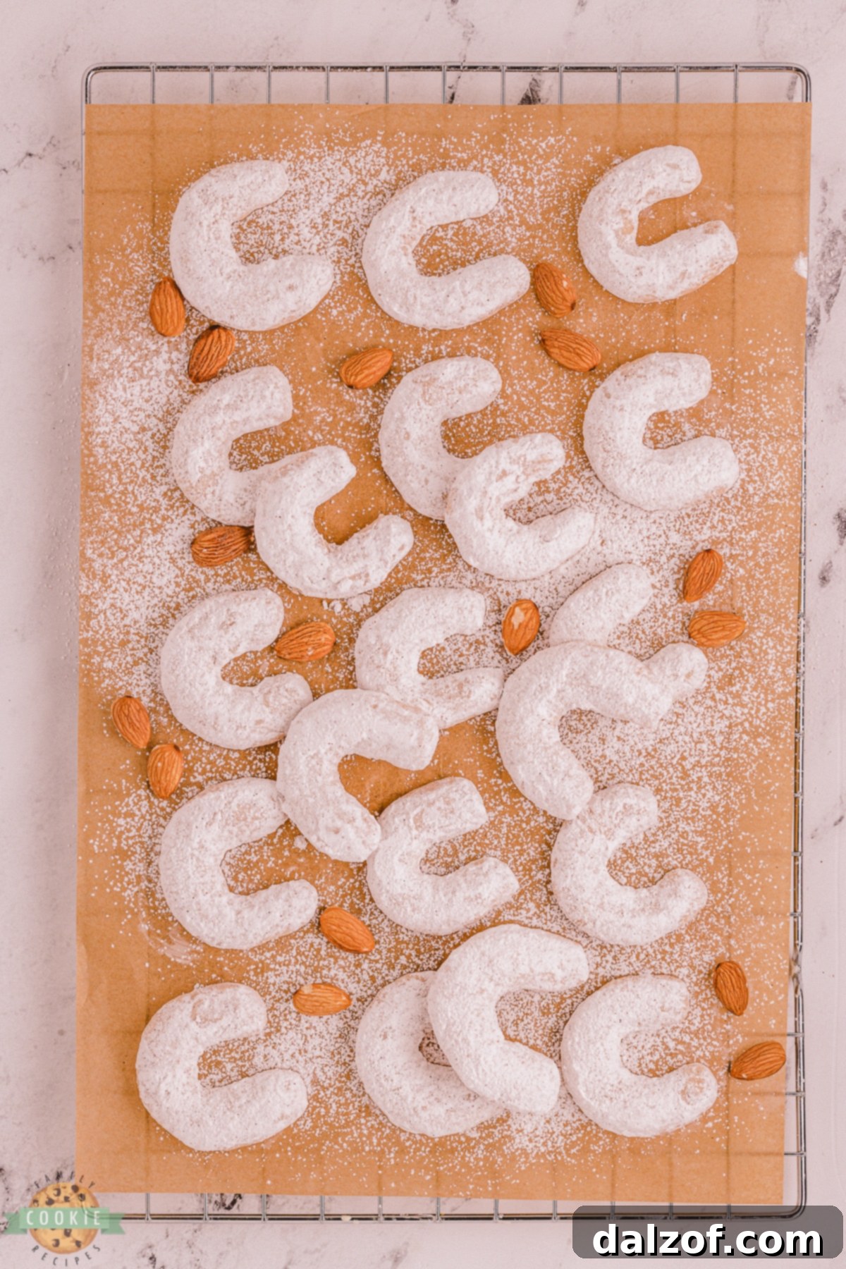 crescent cookies on parchment paper