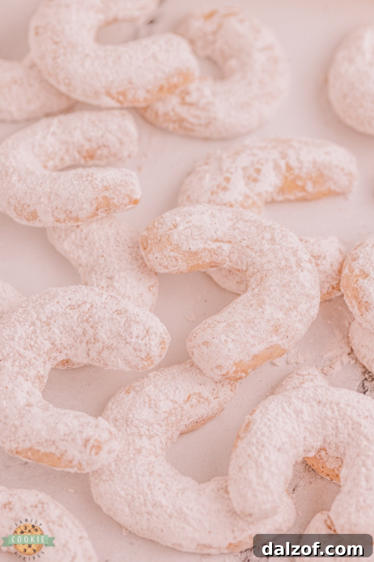 crescent cookies covered in powdered sugar