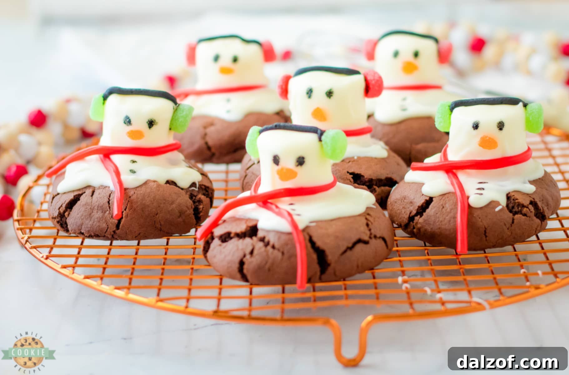 peppermint snowman cookies on a cooling rack
