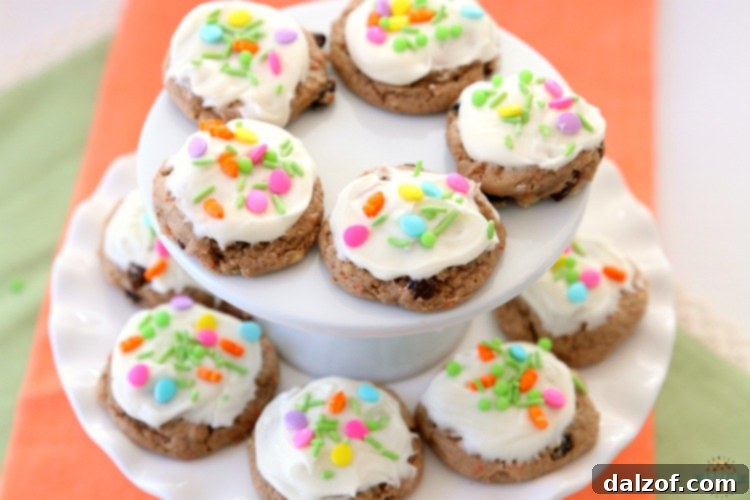 Carrot Cake Cookies are soft and chewy, flavorful carrot cake cookies made with a cake mix! Topped with a creamy cheesecake frosting, these carrot cake cookies are perfect for Easter! 