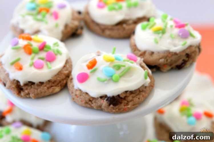 Carrot Cake Cookies are soft and chewy, flavorful carrot cake cookies made with a cake mix! Topped with a creamy cheesecake frosting, these carrot cake cookies are perfect for Easter! 