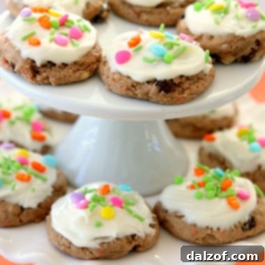 Carrot Cake Cookies are soft and chewy, flavorful carrot cake cookies made with a cake mix! Topped with a creamy cheesecake frosting, these carrot cake cookies are perfect for Easter! 