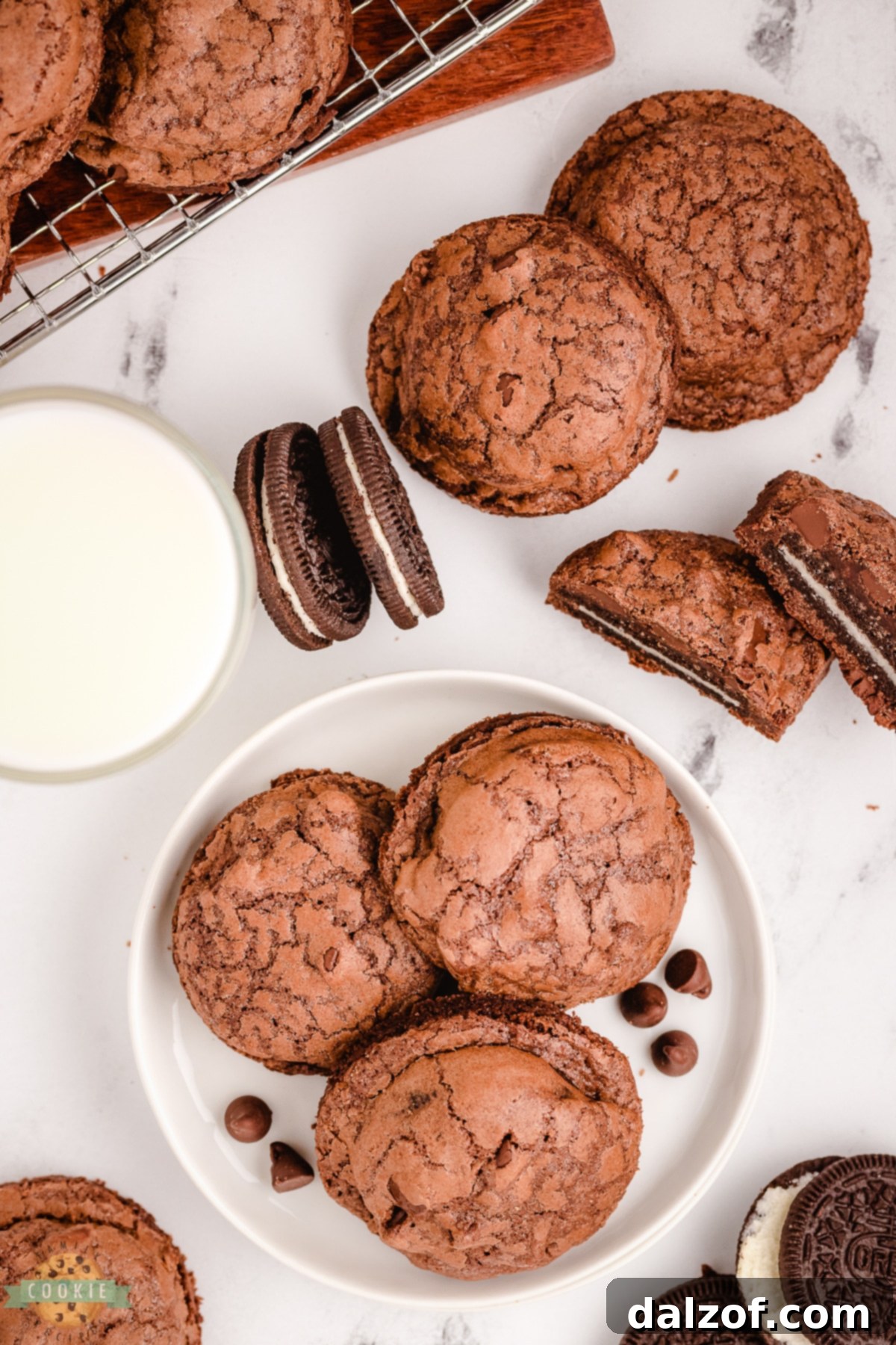A plate of chocolate brownie cookies with whole Oreos baked inside, showcasing the rich texture