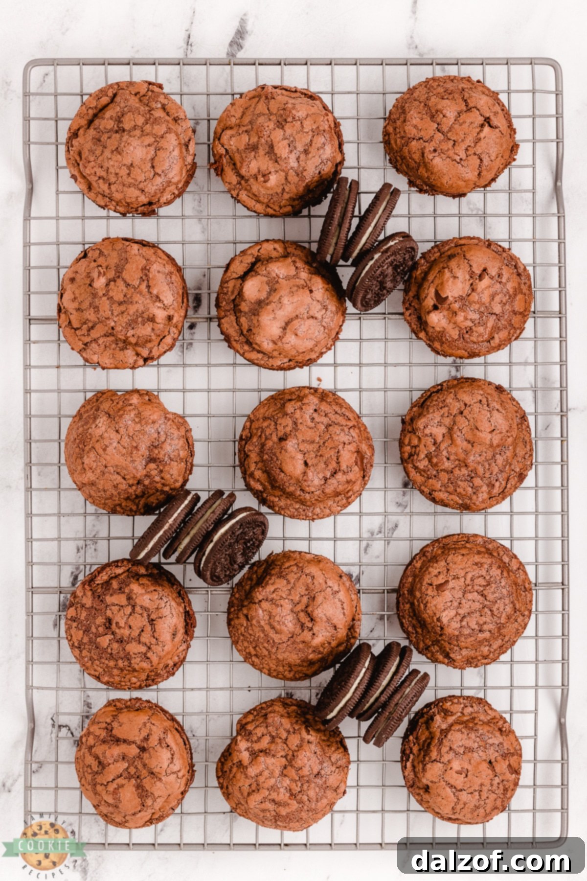 Freshly baked Oreo brownie cookies cooling on a wire rack