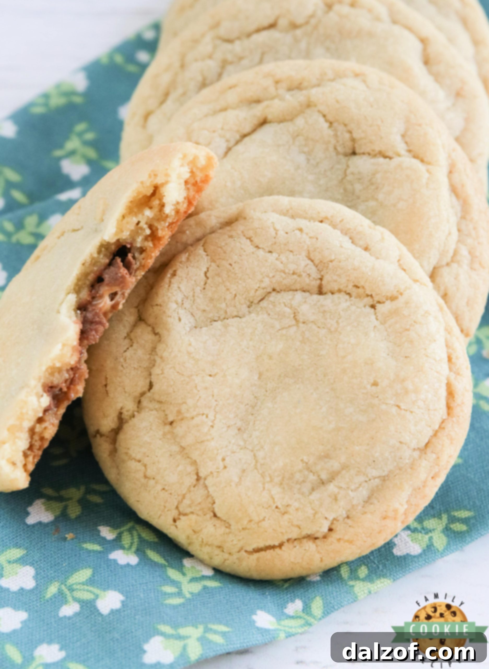 Delicious cookies, freshly baked, with chocolate caramel candies melting in the middle, ready to be enjoyed.