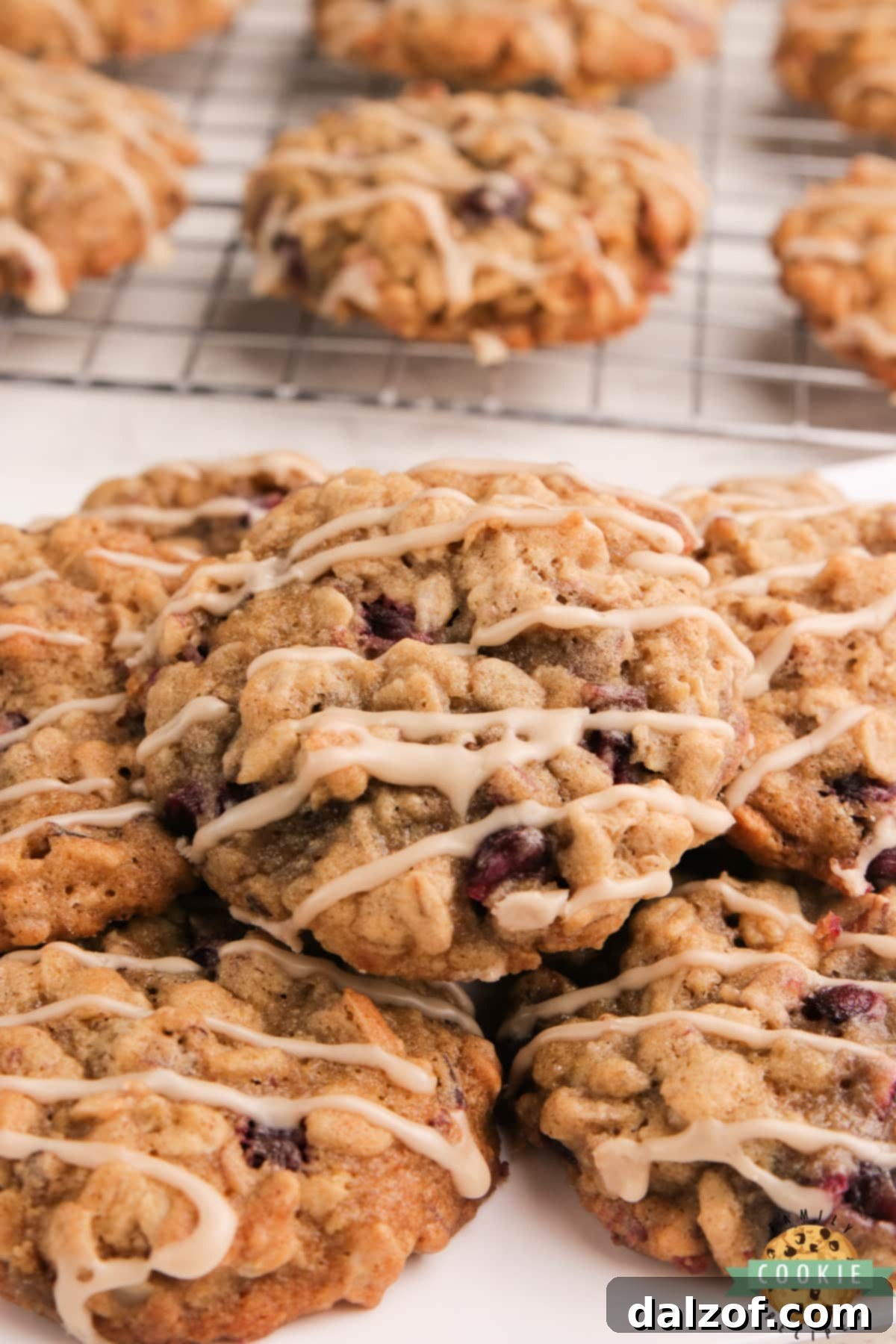Soft, chewy Glazed Pomegranate Oatmeal Cookies with maple glaze