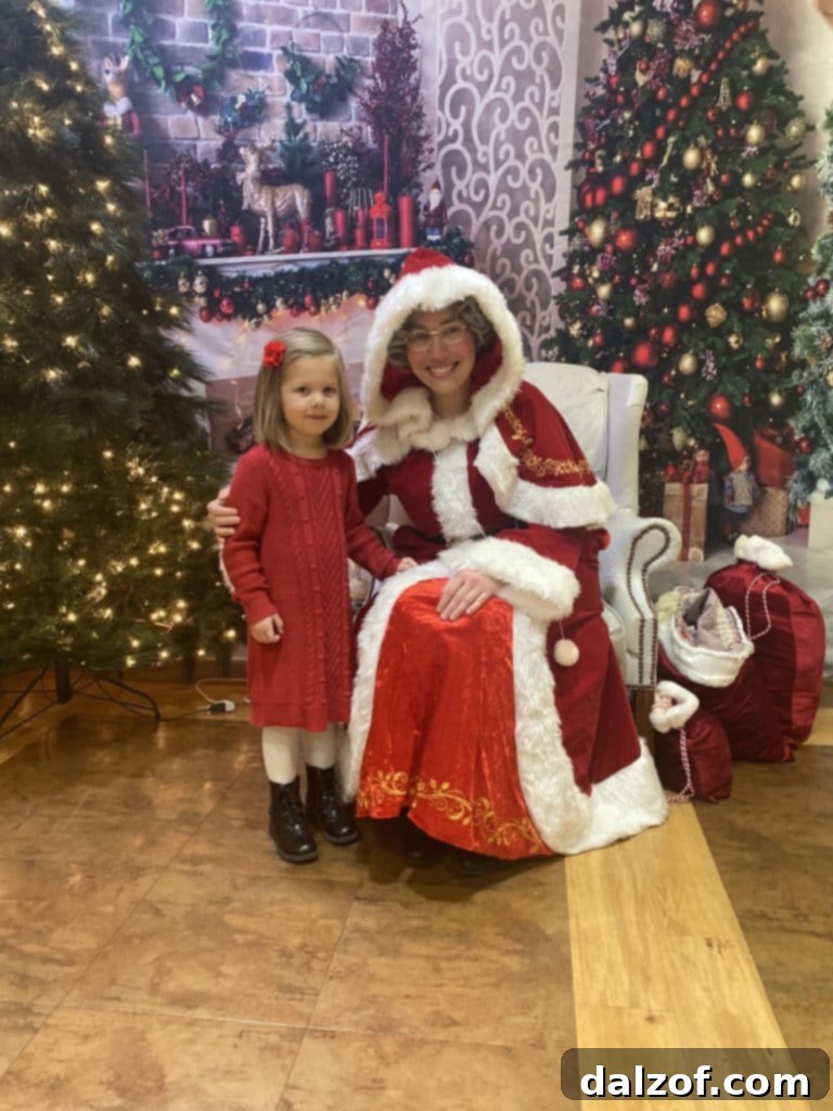 Decadent Chocolate Oatmeal Cream Pies 15 A young girl, possibly Miss B, posing with Mrs. Claus during a Christmas preschool program, creating a sweet family memory.