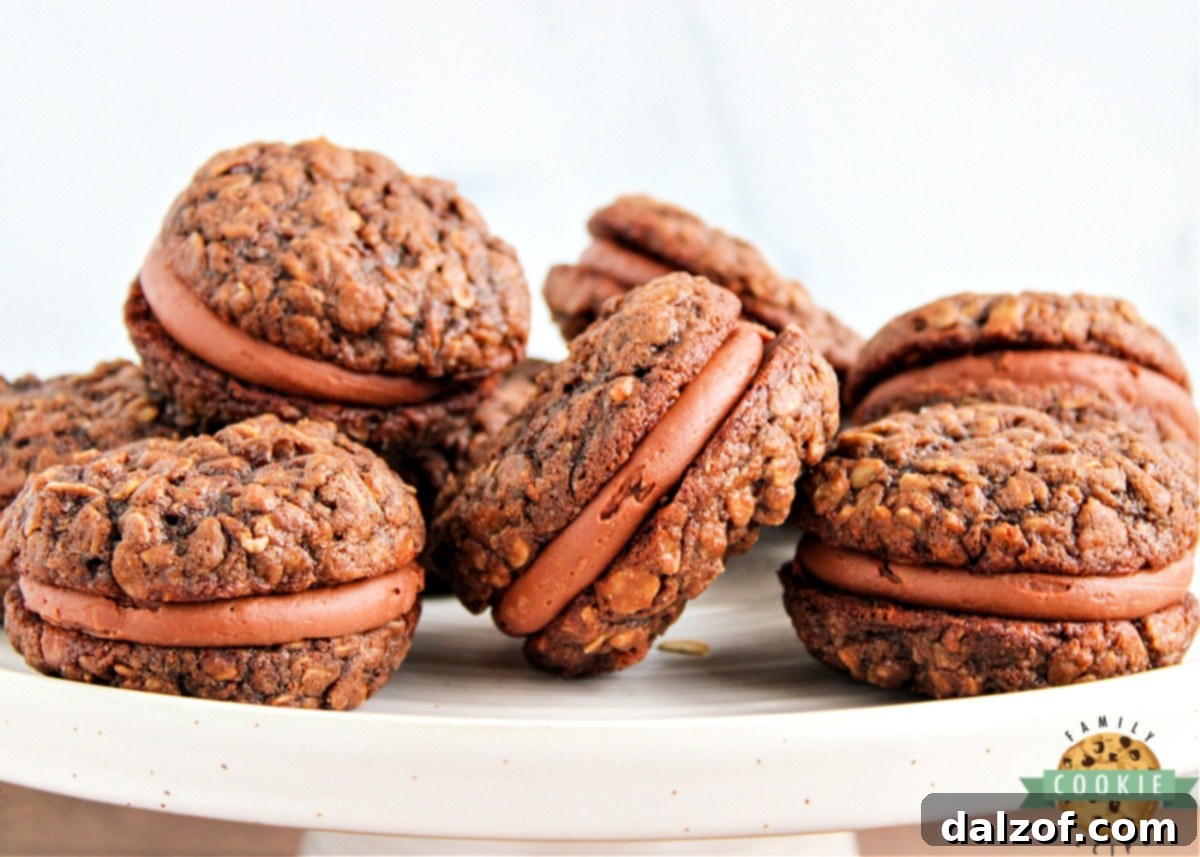 Decadent Chocolate Oatmeal Cream Pies 3 Freshly baked Chocolate Oatmeal Cream Pies stacked, ready to be enjoyed.