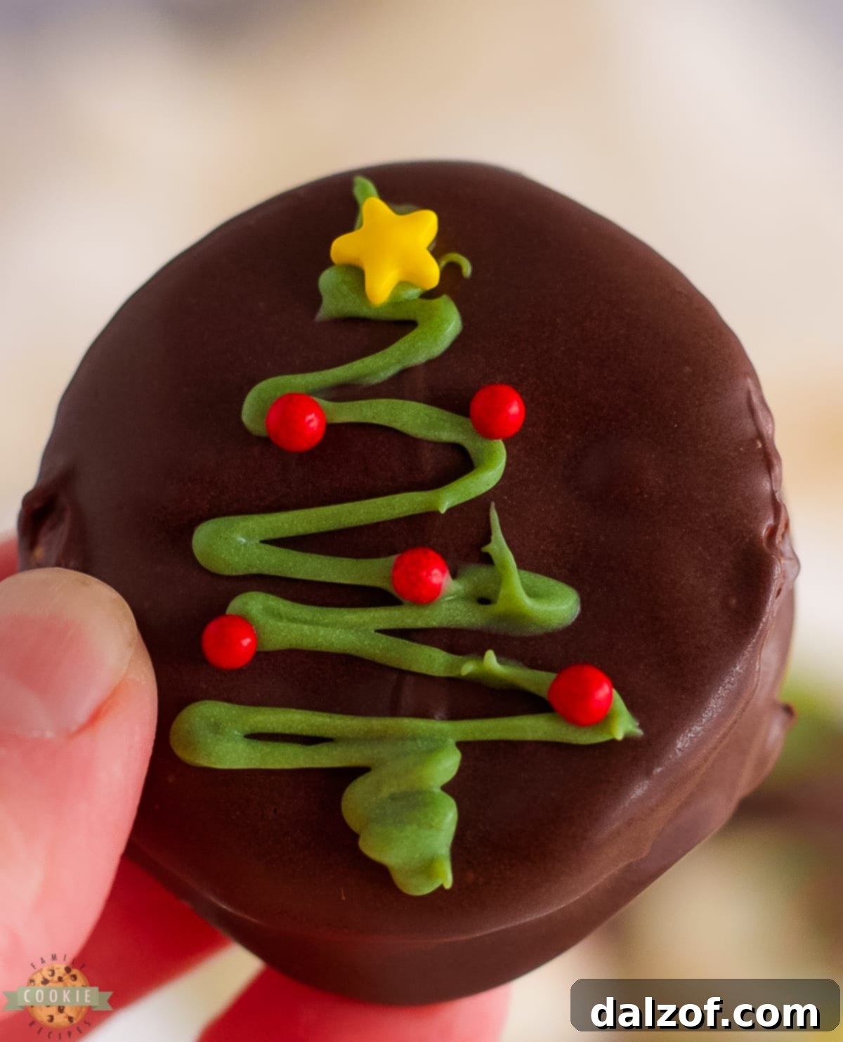 Christmas tree decoration on a chocolate-covered Ritz cracker cookie