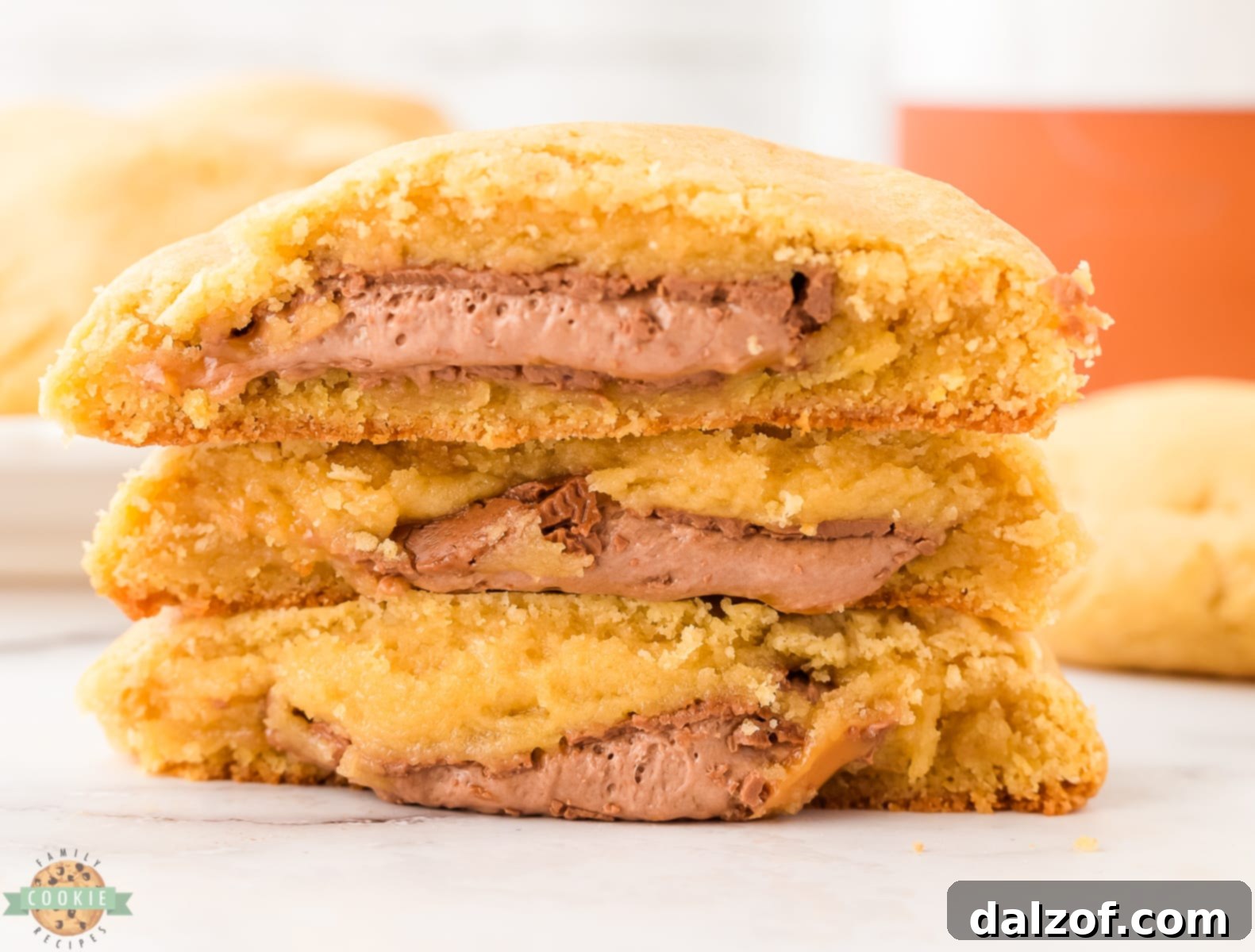 array of stuffed cookies featuring Milky Way candies, with some cut open to reveal the gooey center