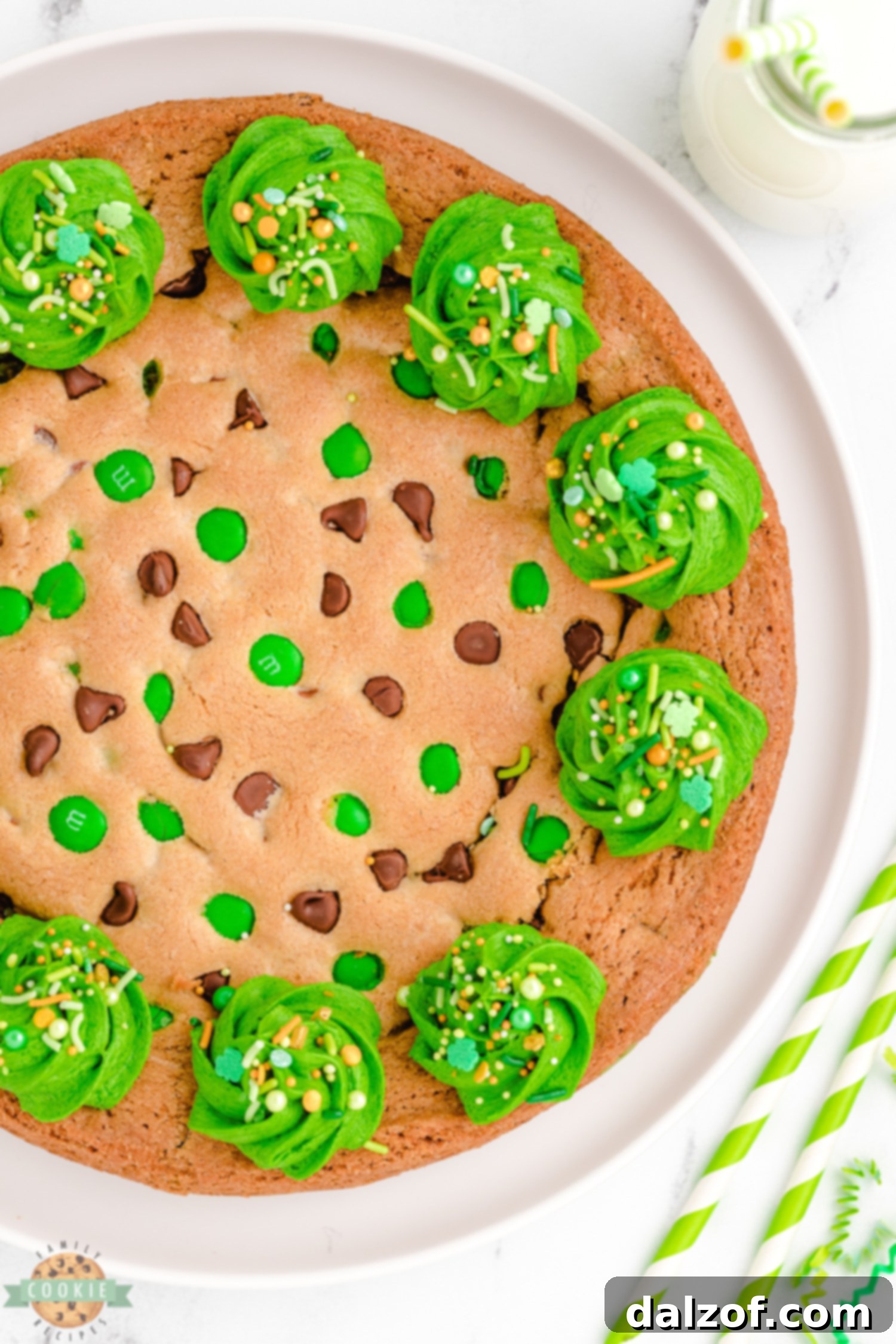 A festive green cookie cake topped with M&M's