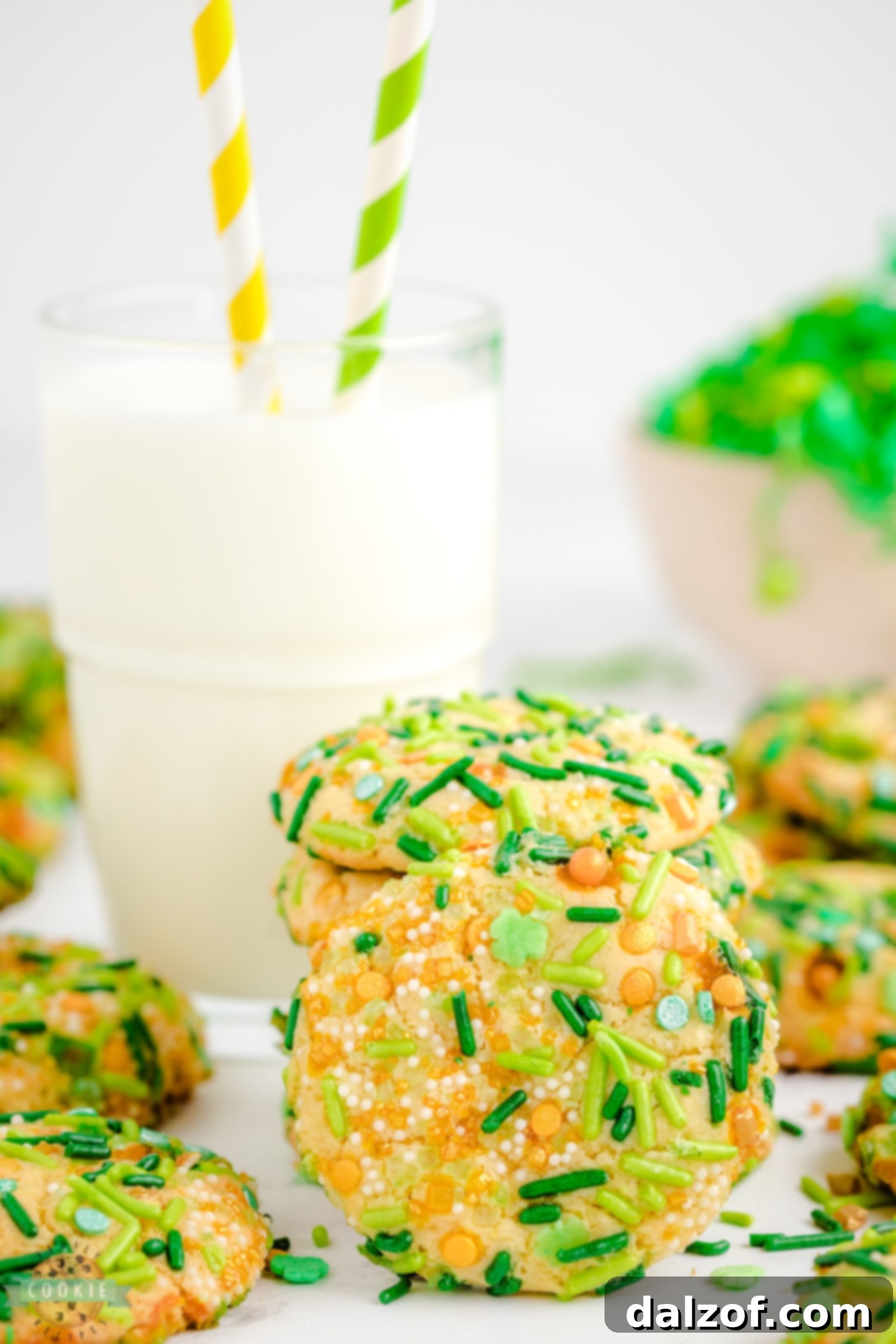 Green sprinkle cookies with a glass of milk, a perfect St. Patrick's Day treat.