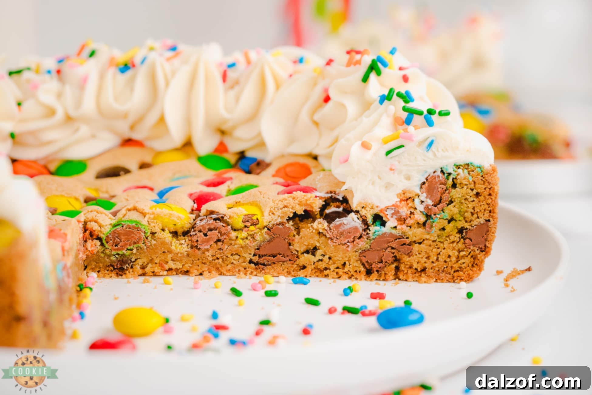 chocolate chip M&M cookie cake cut into