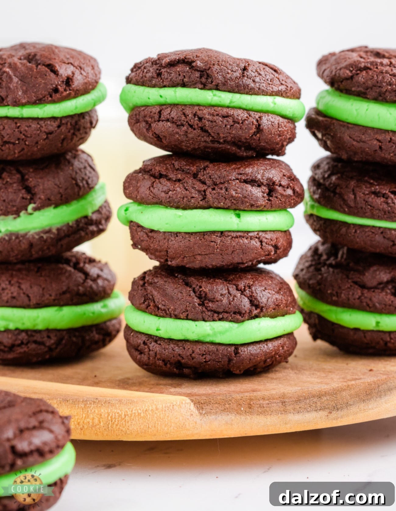 Stacks of freshly baked mint oreo cookies with green filling, made with a cake mix