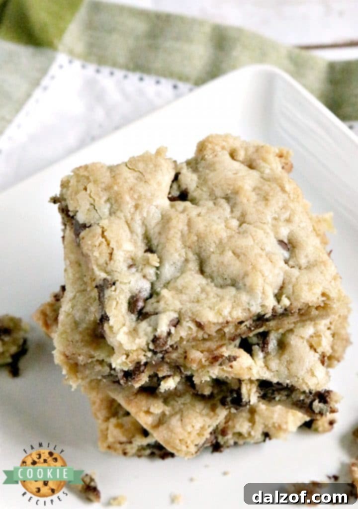 Oatmeal Chocolate Chip Cookie Bars are soft, chewy and easy to make when you don't have time to scoop individual cookies! This delicious cookie bar recipe is filled with oats and chocolate chips and comes together in just a few minutes.