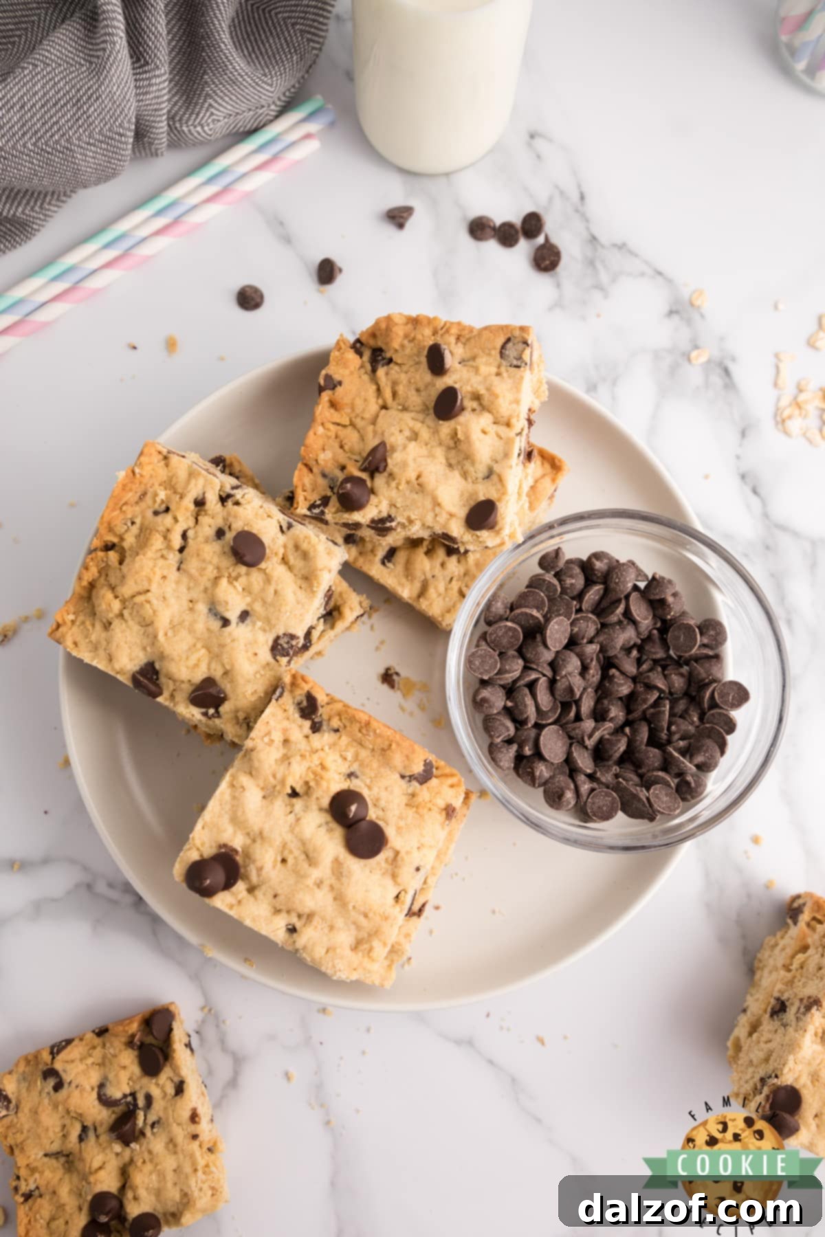 A pan of baked Oatmeal Chocolate Chip Bars with some pieces already cut out