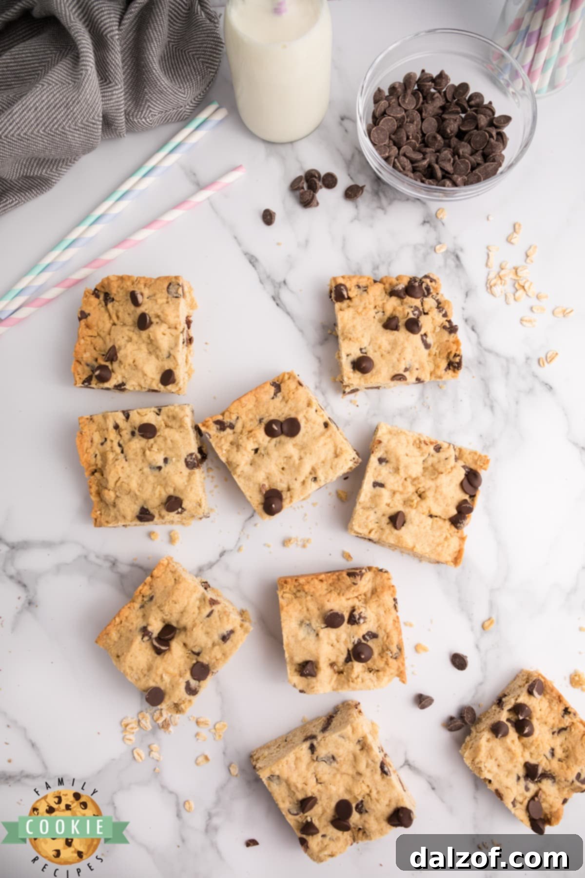 A stack of Oatmeal Chocolate Chip Bars with a bite taken out of one