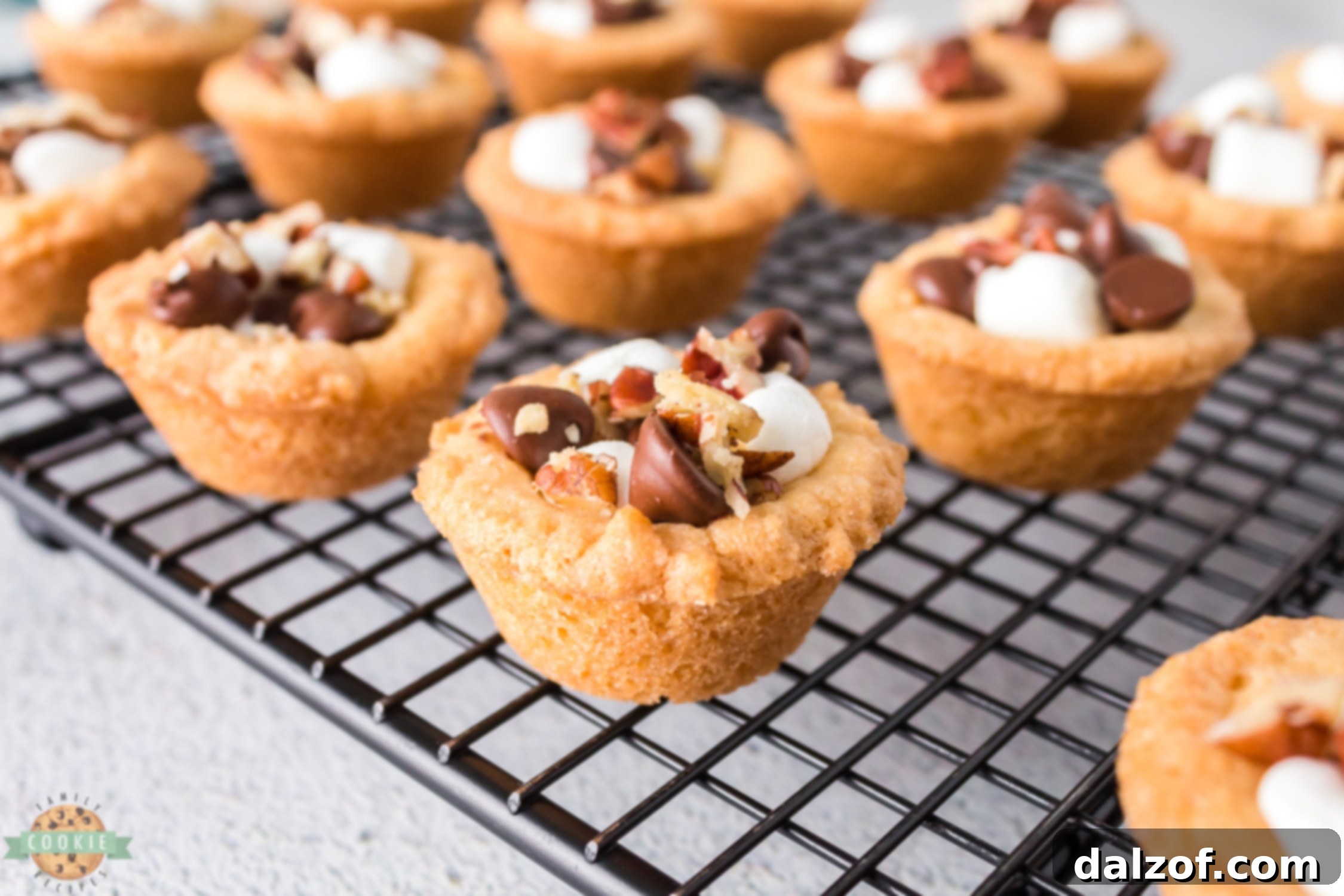 Rocky Road Cookies cooling on a wire rack, showing the perfect golden edges.