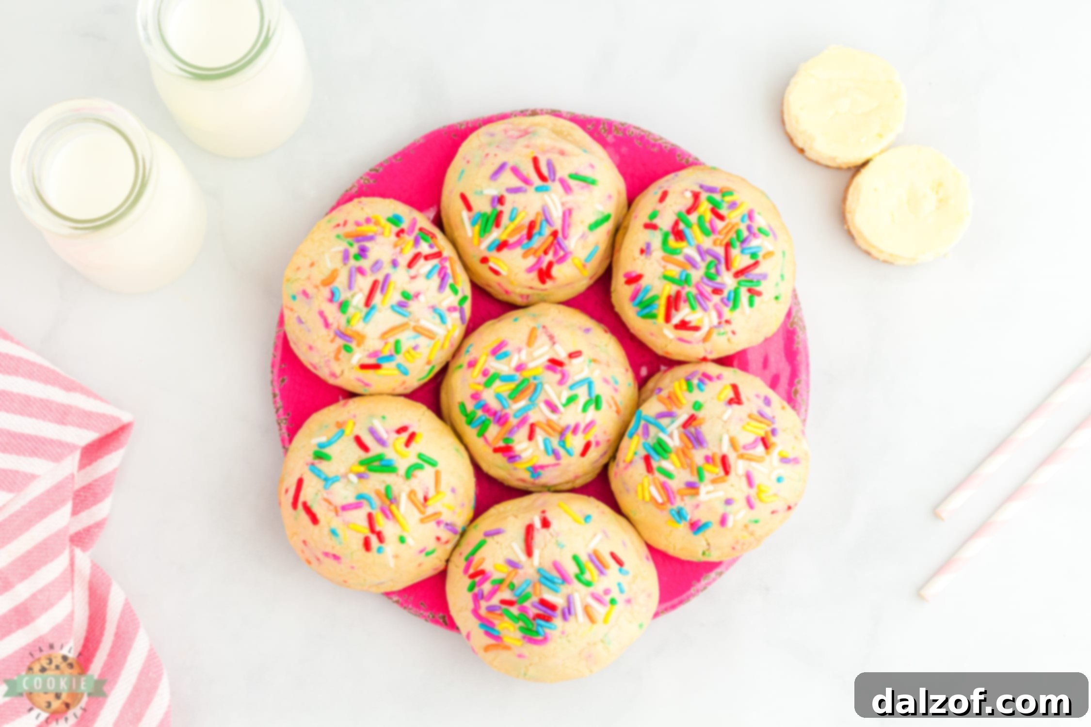 pink tray of cheesecake stuffed funfetti cookies