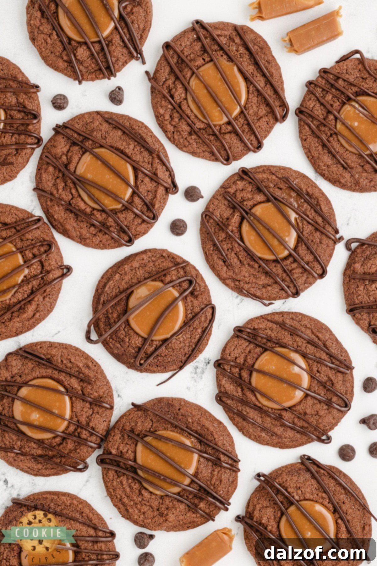 Chocolate thumbprint cookies with a rich caramel filling and decorative chocolate drizzle