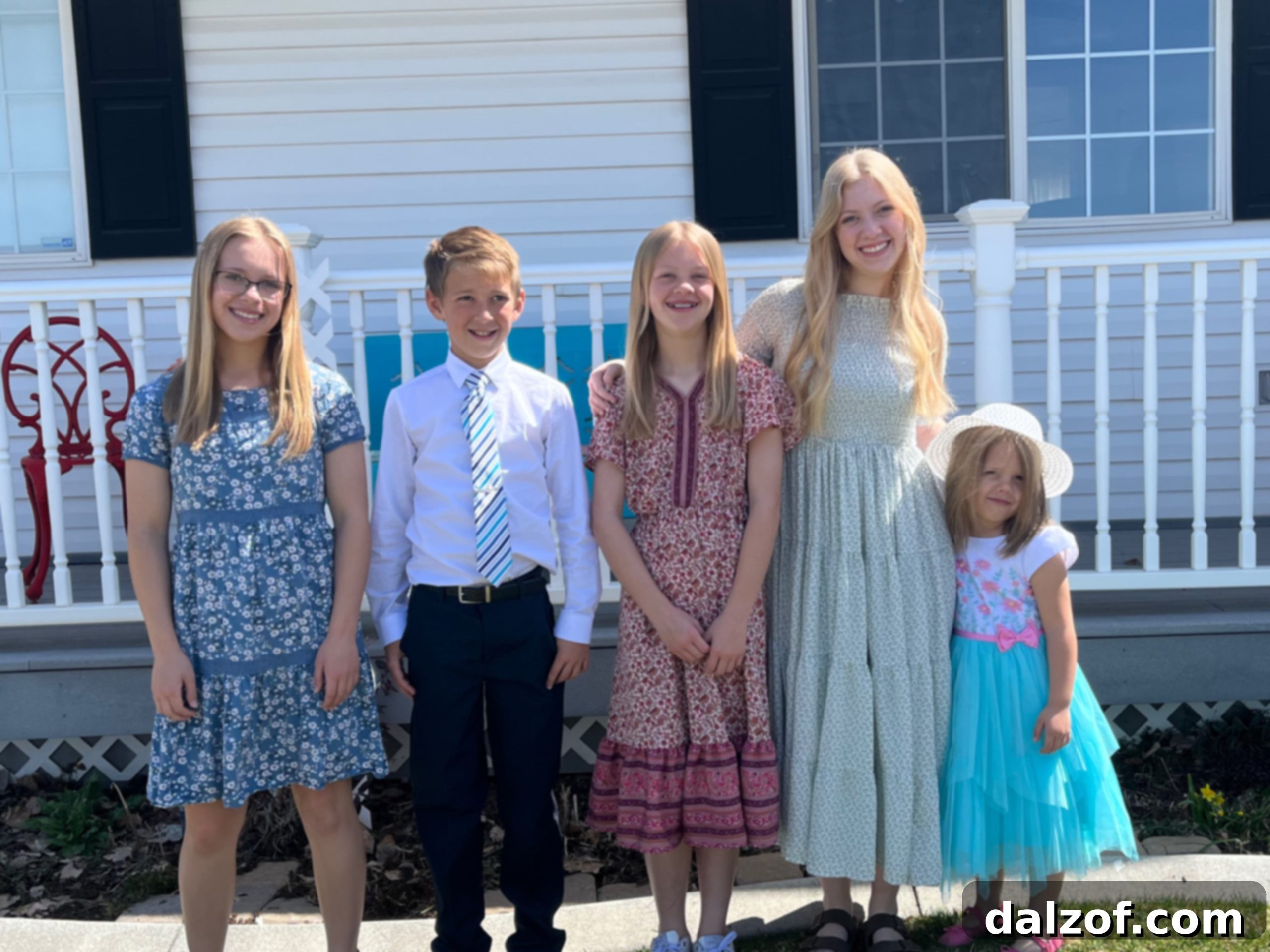 A group of smiling children enjoying an outdoor activity, possibly related to Easter.