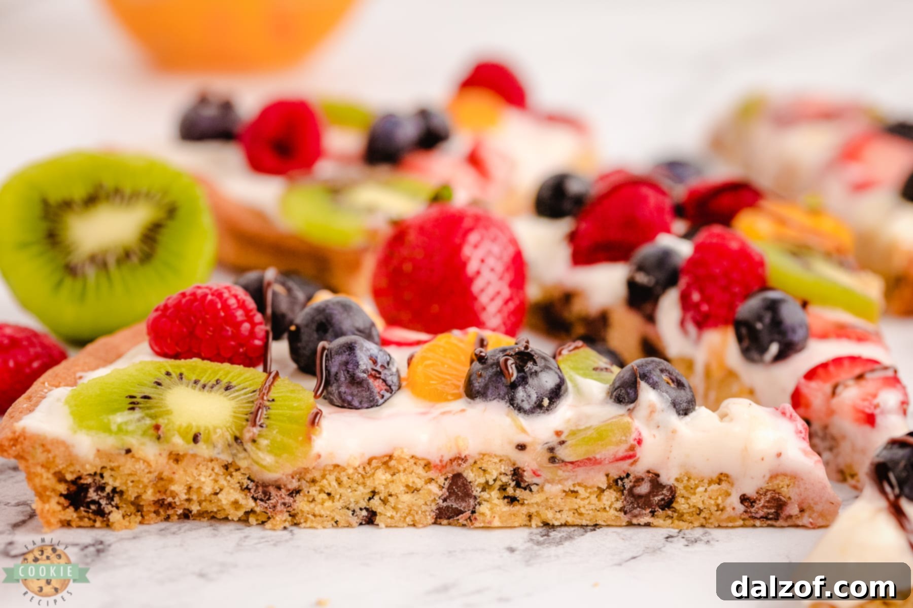 slice of chocolate chip cookie pizza with fruit