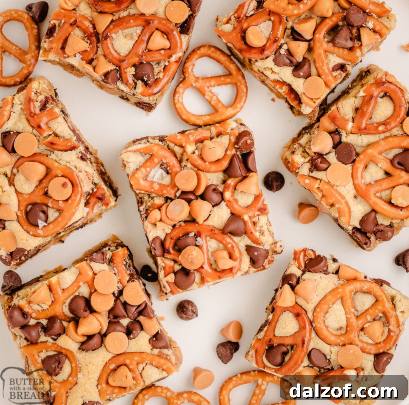 Close-up of butterscotch cookie bars with pretzels baked on top, highlighting the textures and golden-brown edges.
