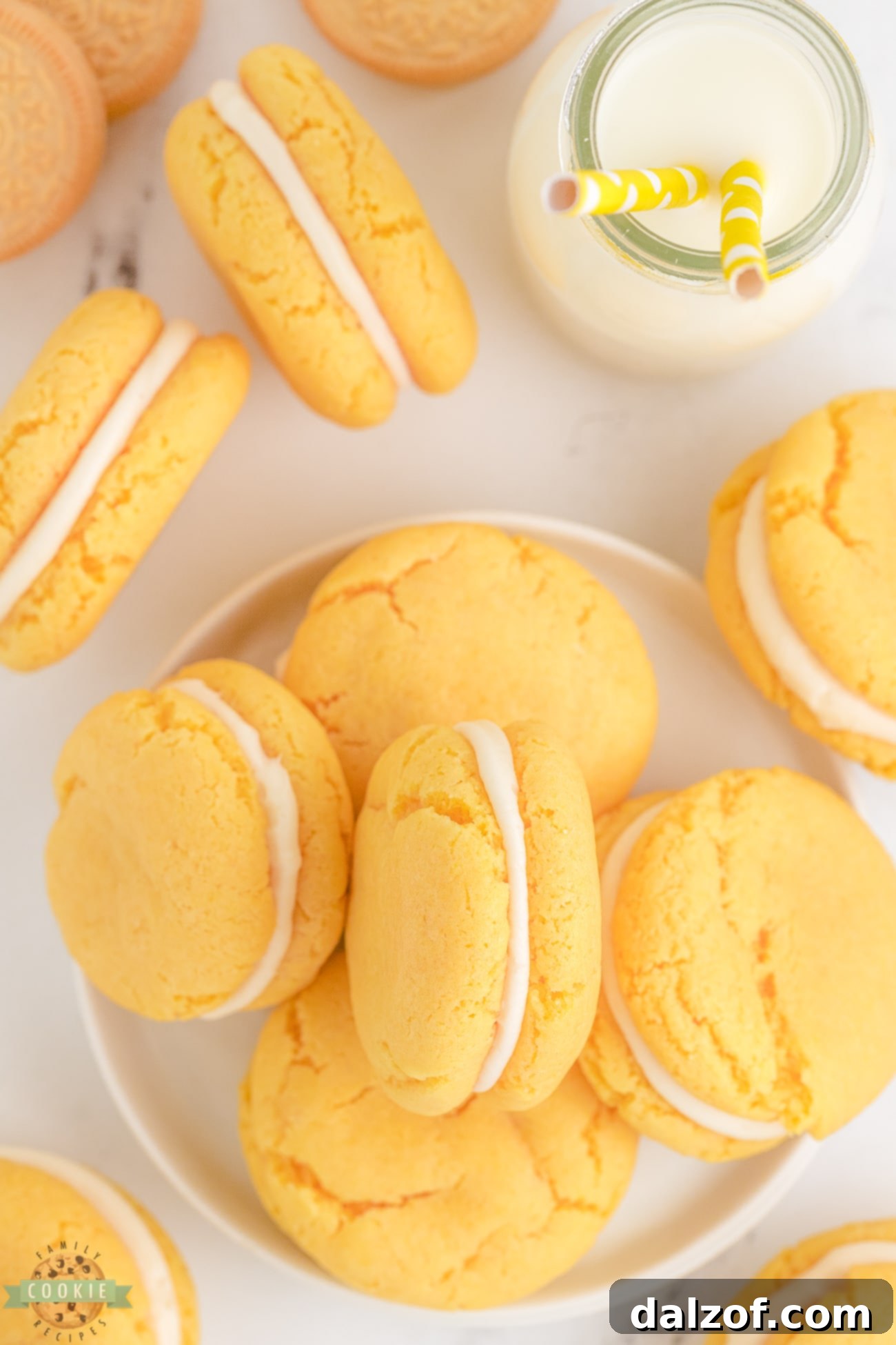 Homemade golden Oreo cookies filled with fluffy cream cheese frosting, stacked neatly