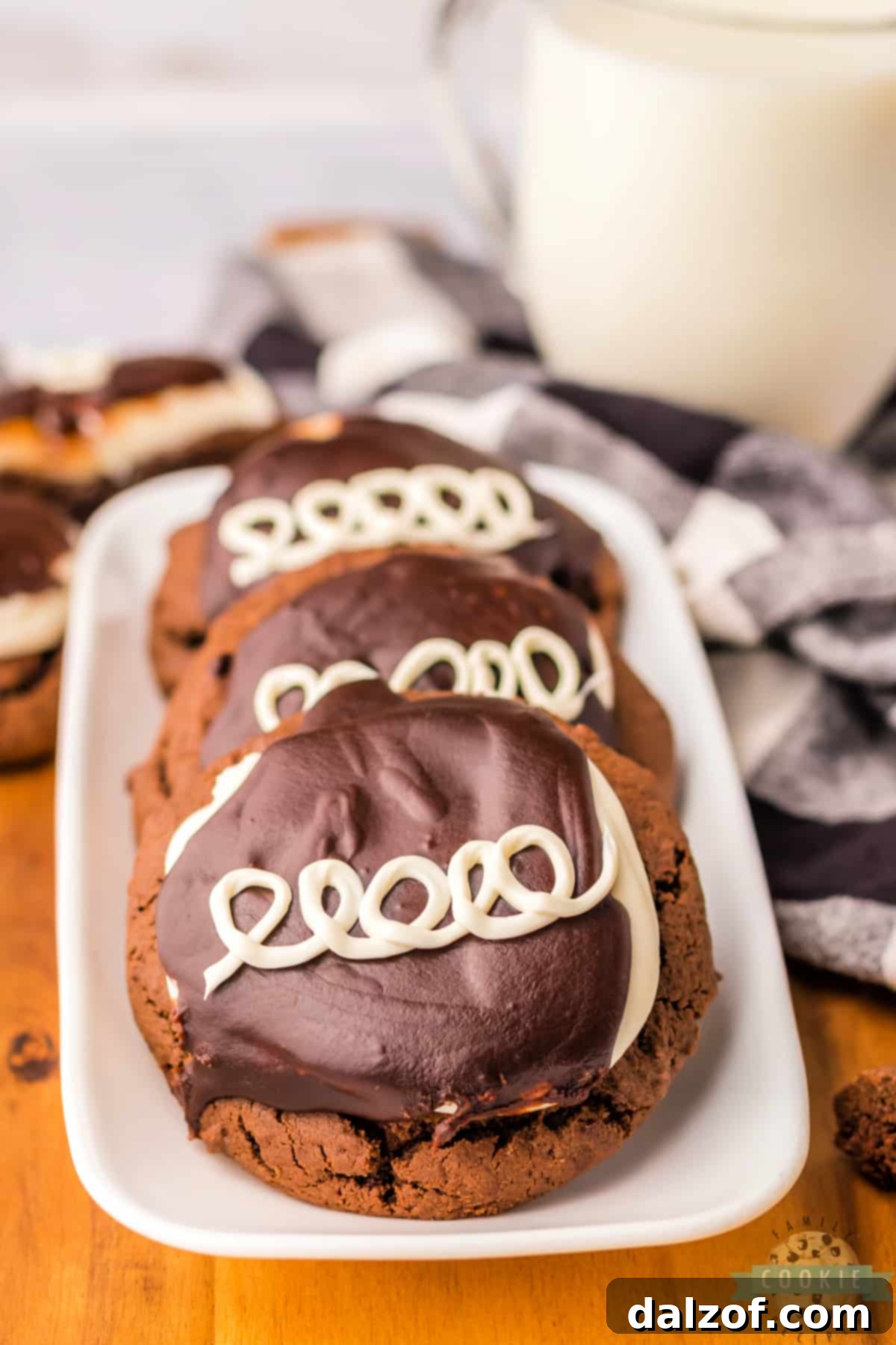Chocolate cookies frosted with marshmallow buttercream and chocolate ganache