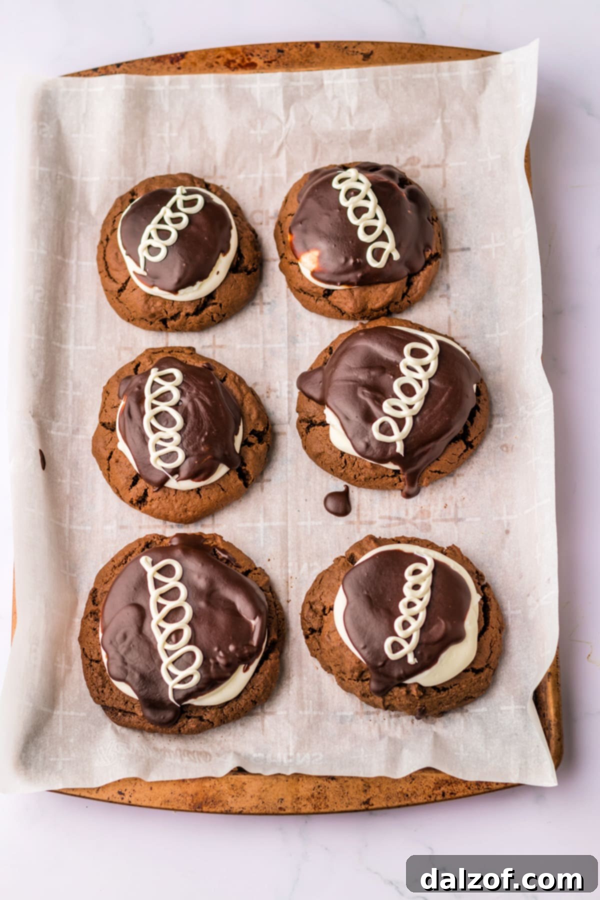 Chocolate cookies frosted with marshmallow buttercream and chocolate ganache