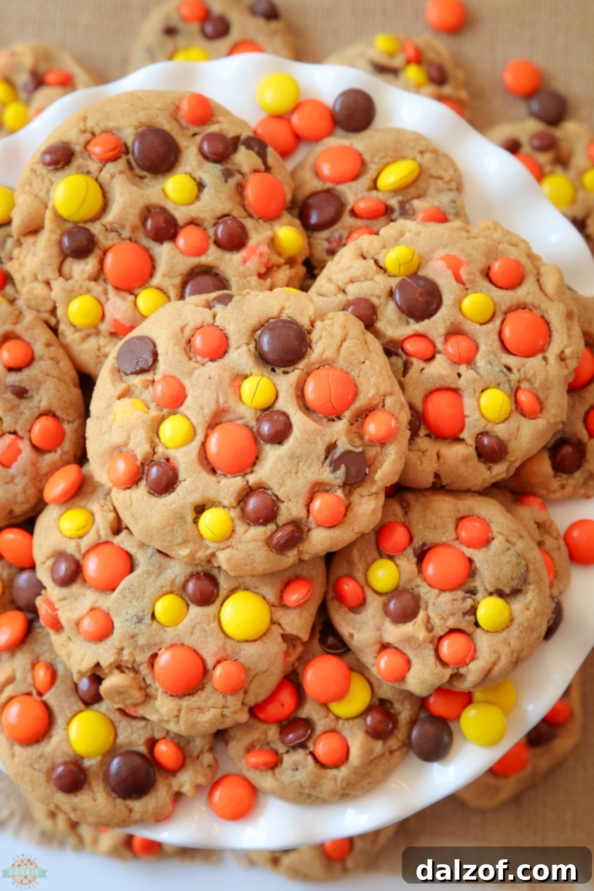The Best Reese's Peanut Butter Cookies 4 Close-up of freshly baked Reese's Peanut Butter Cookies stacked on a white plate