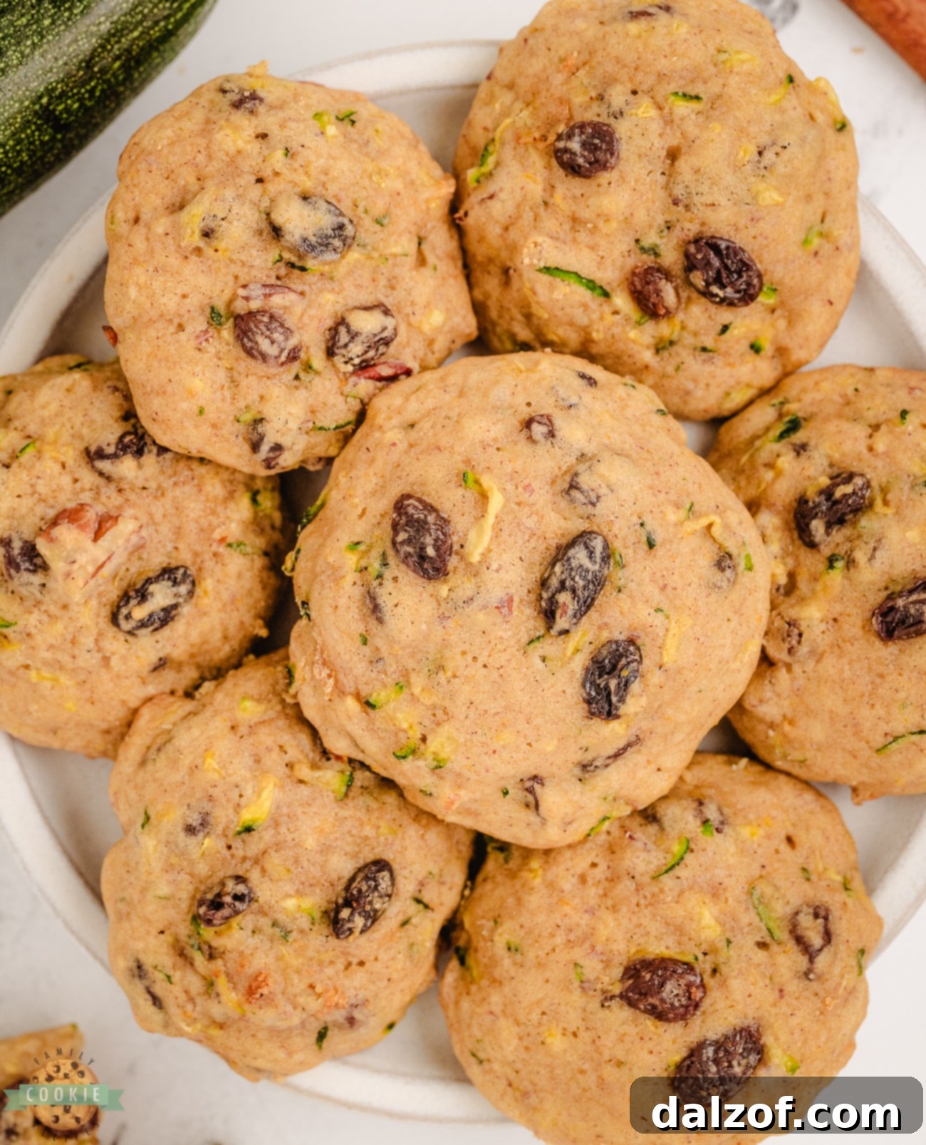 Warm zucchini breakfast cookies cooling on a plate