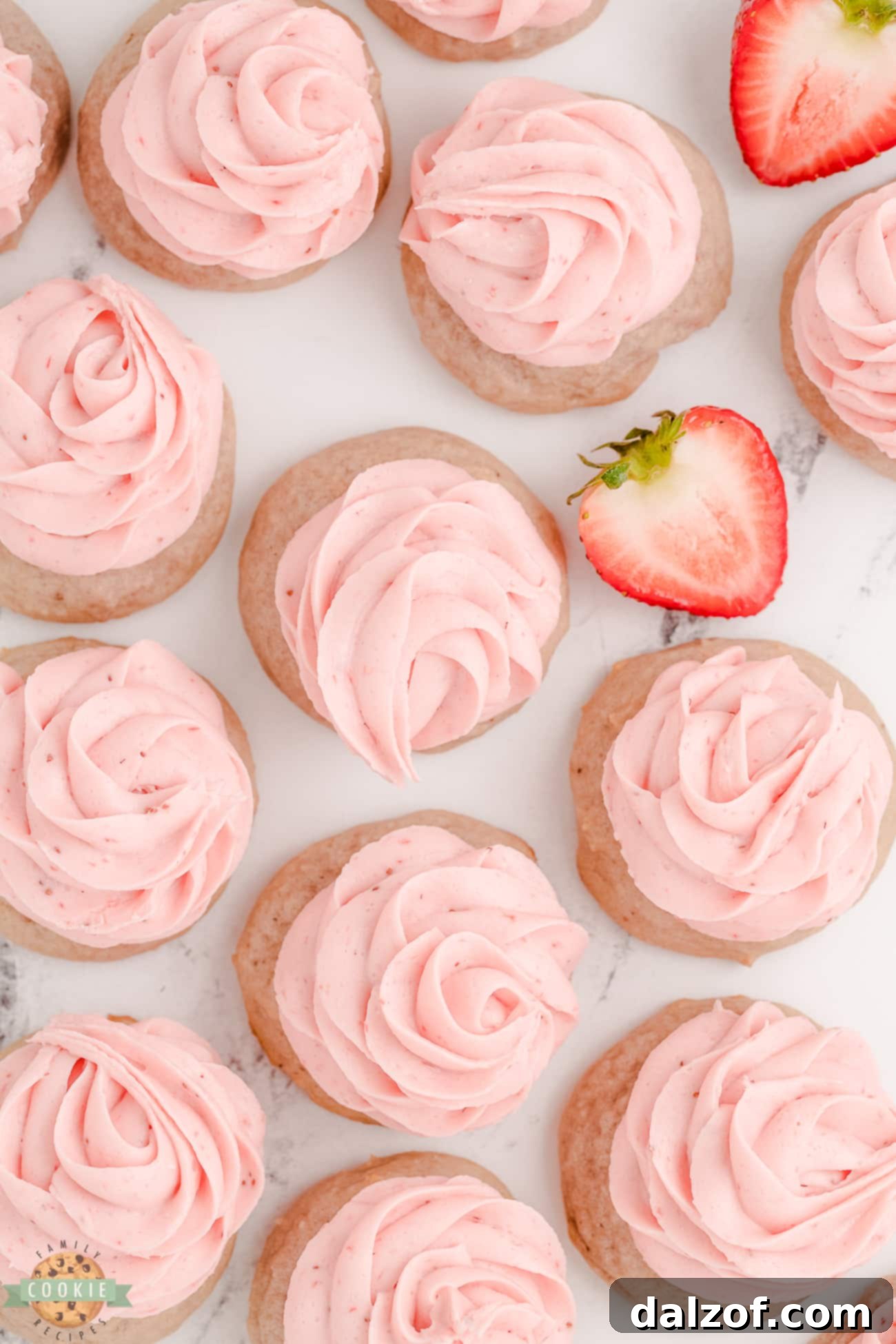 Sweet Frosted Strawberry Cookies 5 A plate of strawberry cookies topped with beautifully piped strawberry buttercream rosettes, ready to be served.