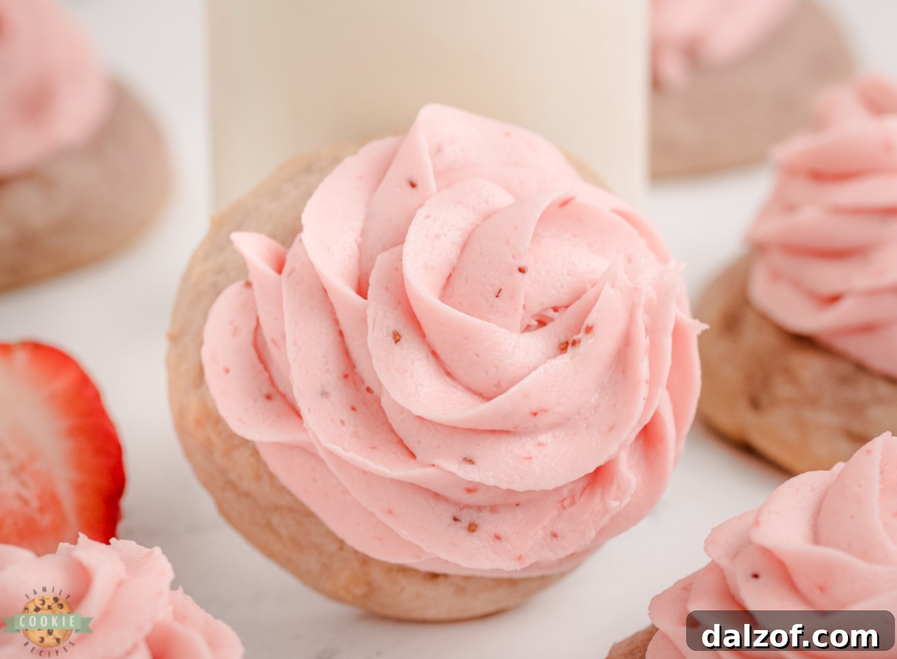 Sweet Frosted Strawberry Cookies 6 A frosted strawberry cookie with a glass of milk, inviting a delightful snack.