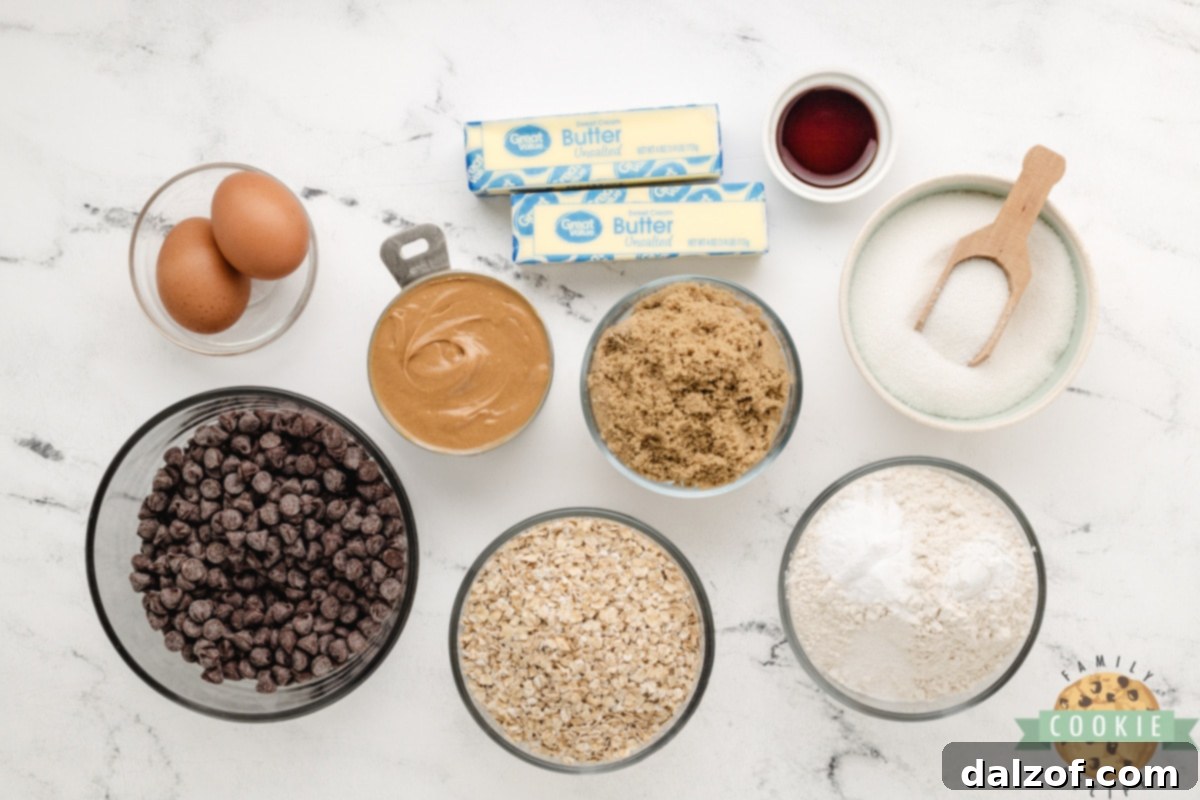 Arrangement of essential ingredients for Peanut Butter Oatmeal Chocolate Chip Cookies, including flour, oats, peanut butter, and chocolate chips.