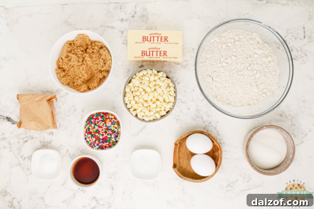 A colorful array of ingredients laid out for making Funfetti Cookies, including flour, sugars, butter, eggs, pudding mix, and sprinkles.