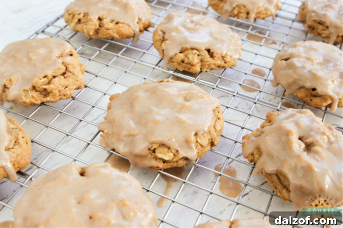 Glazed cookies drying on wire rack.