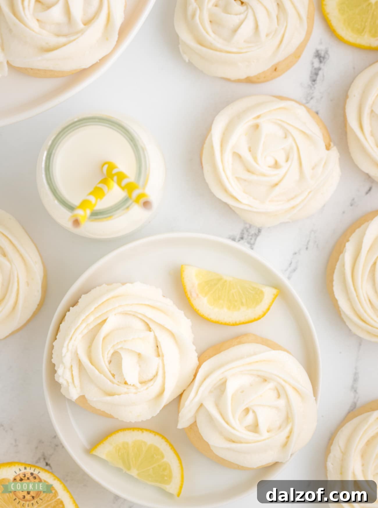 A close-up of a stack of delightful lemon frosted cookies, ready to be enjoyed.