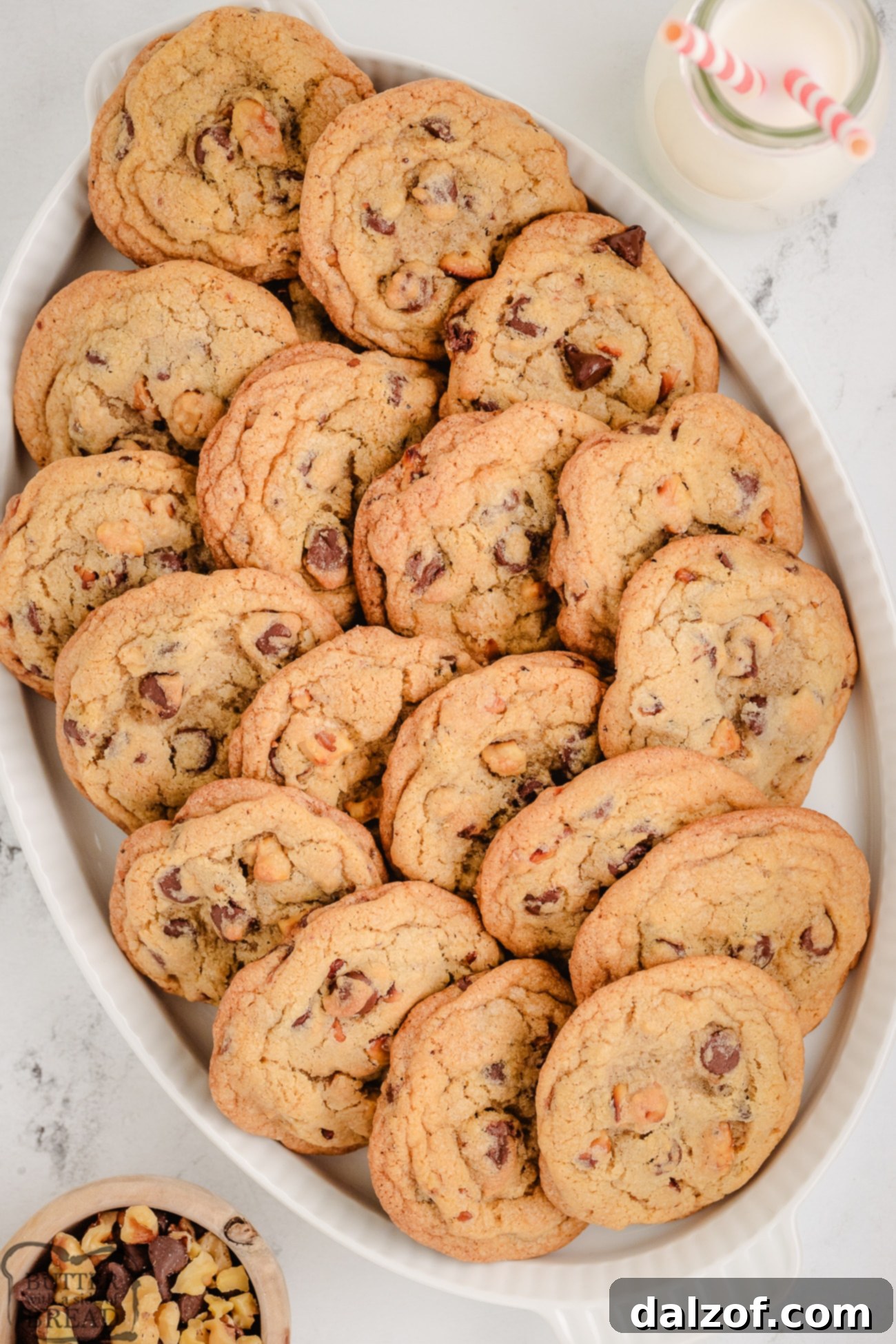 Gourmet Toasted Walnut Chocolate Chip Cookies 3 A rustic plate filled with warm, toasted walnut chocolate chip cookies, ready to be enjoyed.