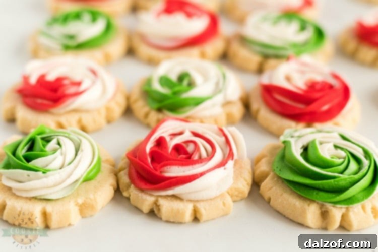 Beautiful Frosted Rose Sugar Cookies with vibrant red and green swirls, perfect for Christmas gifting.