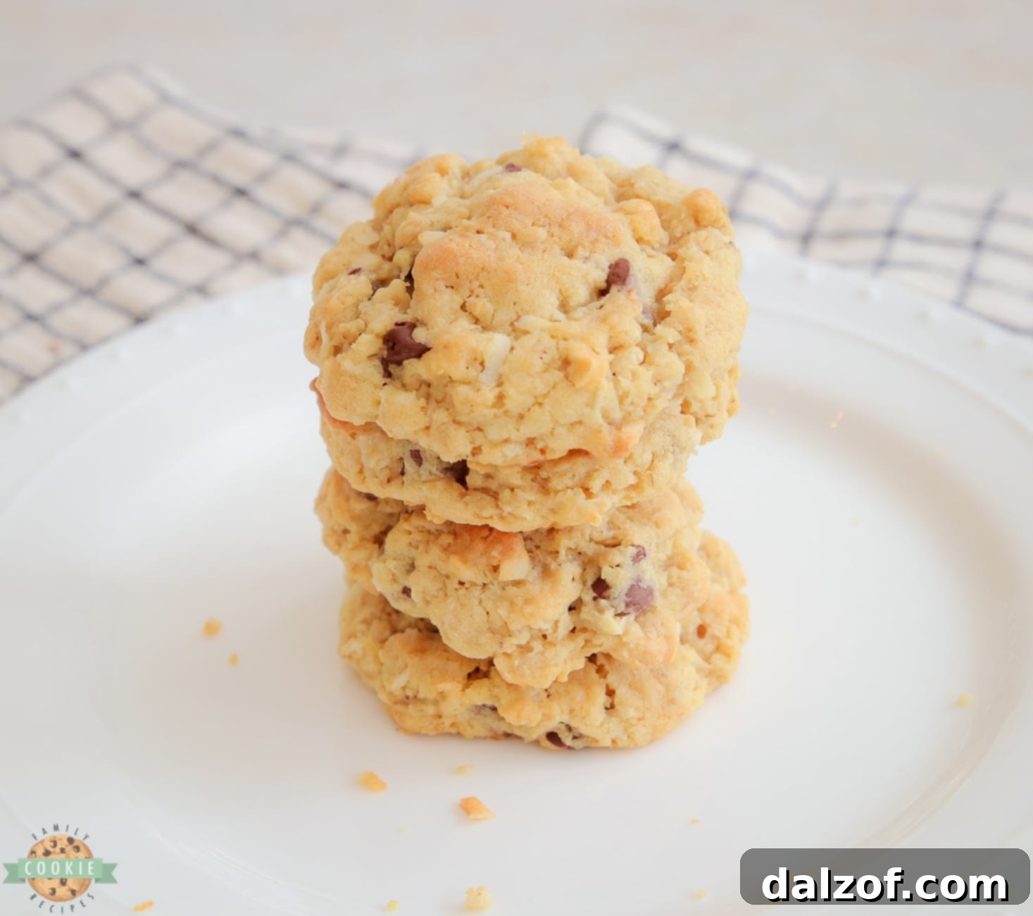 Stack of golden brown Chocolate Chip Ranger cookies with visible oats, chocolate, and crispy cereal