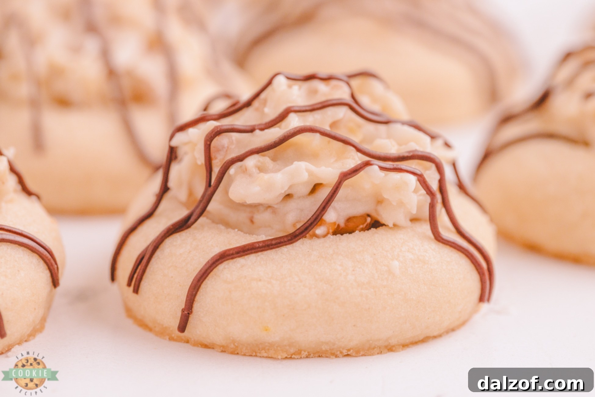coconut butter cookie topped with cream cheese coconut frosting