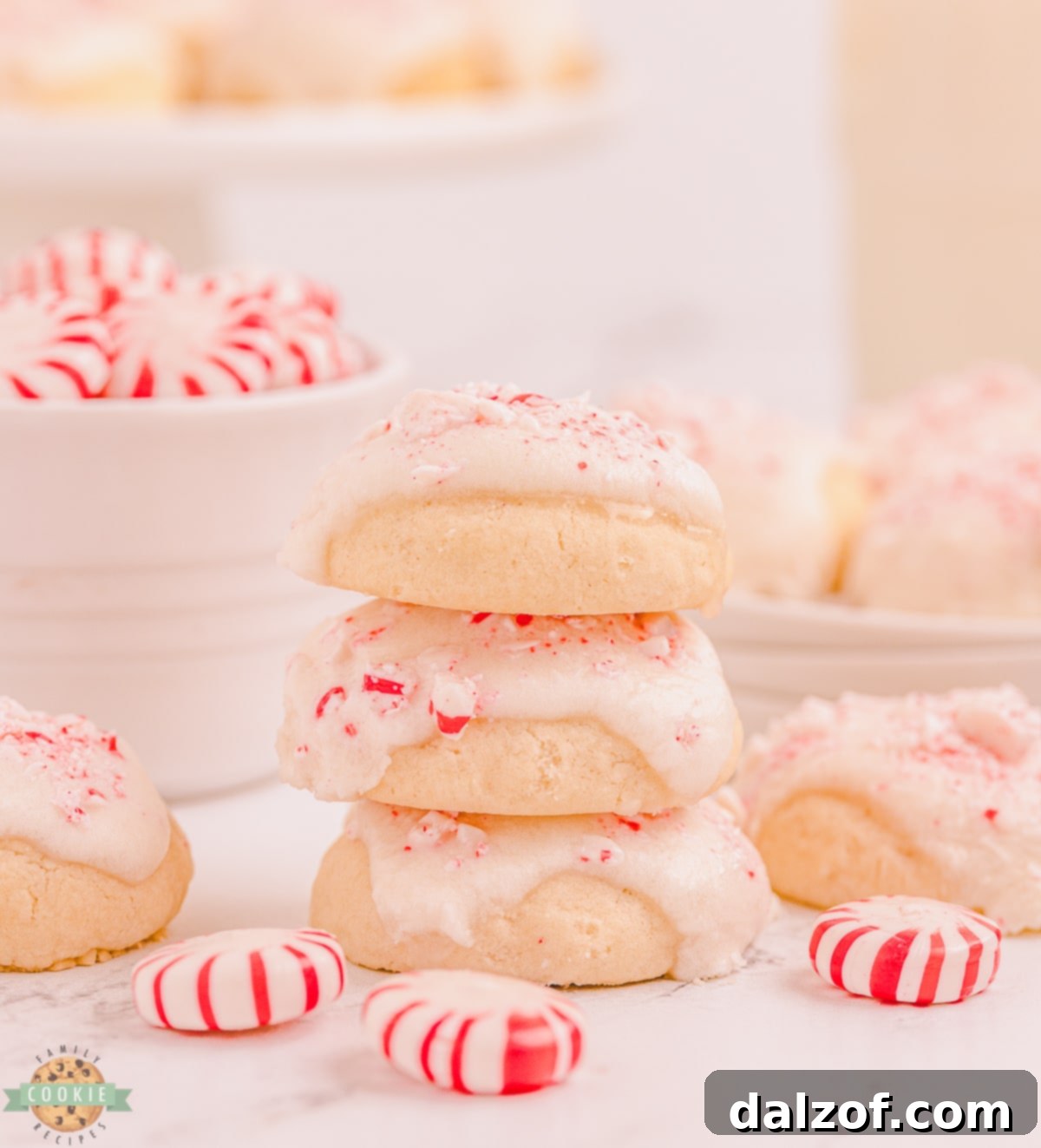 A stack of beautifully glazed Peppermint Vanilla Shortbread Cookies, showcasing their delicate texture and festive appeal.