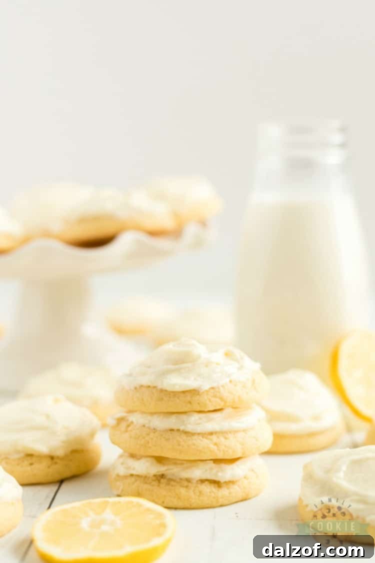 Close-up of a stack of lemon Jello sugar cookies with creamy frosting