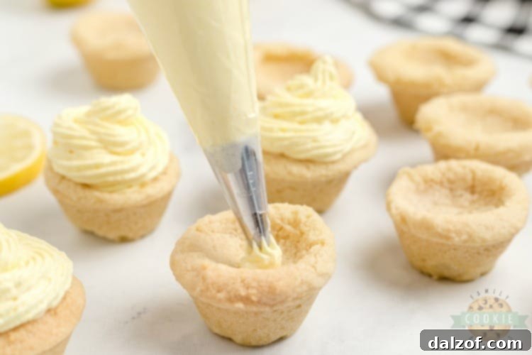 Lemon cream pie cookies are a delicious way to enjoy the tastes of a lemon cream pie without the hassle of pie crust. These lemon cookie cups are easy to grab and go and this lemon cookie recipe makes enough to share.