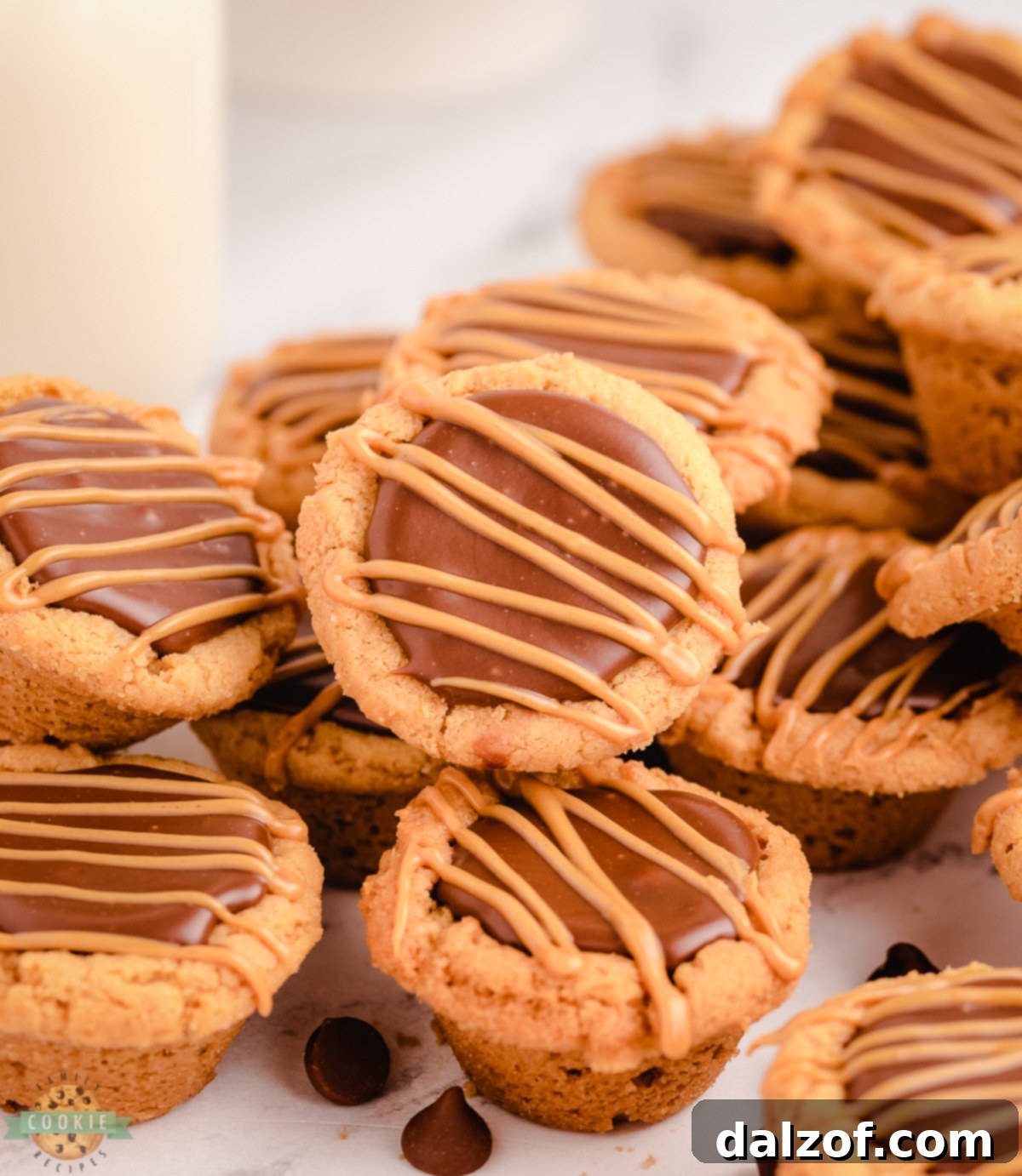 Close-up of peanut butter cookie cups with a generous fudge filling, ready to be enjoyed