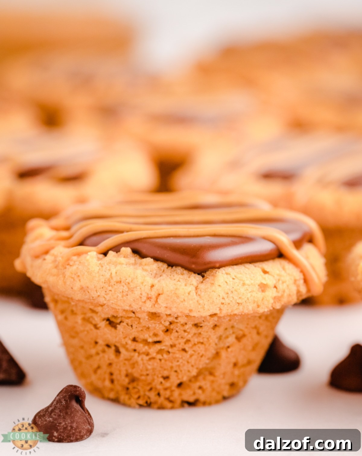 Unbaked peanut butter cookies in a mini muffin pan, ready for the oven