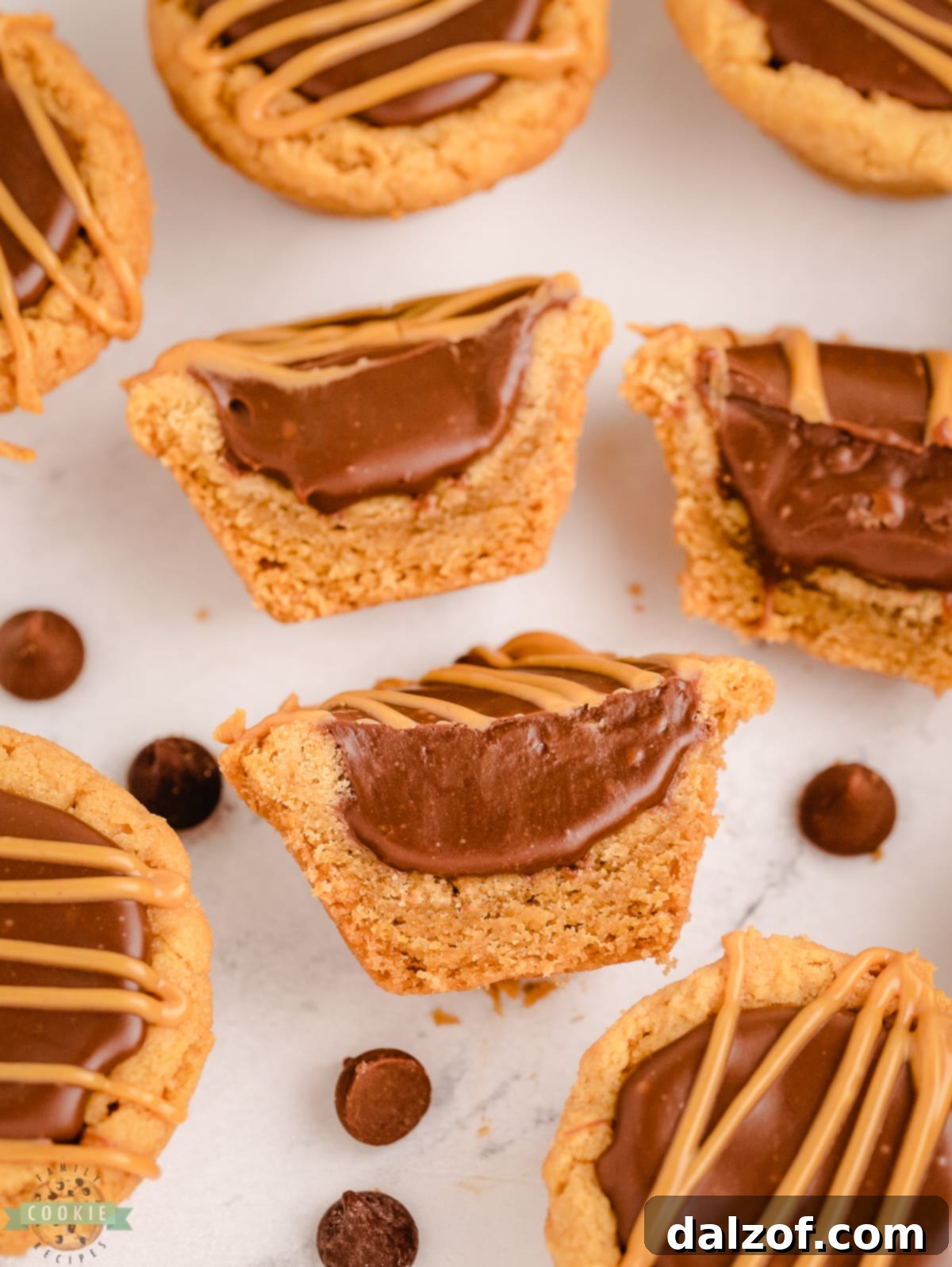 A fudge cookie cup cut in half, showcasing the thick fudge layer