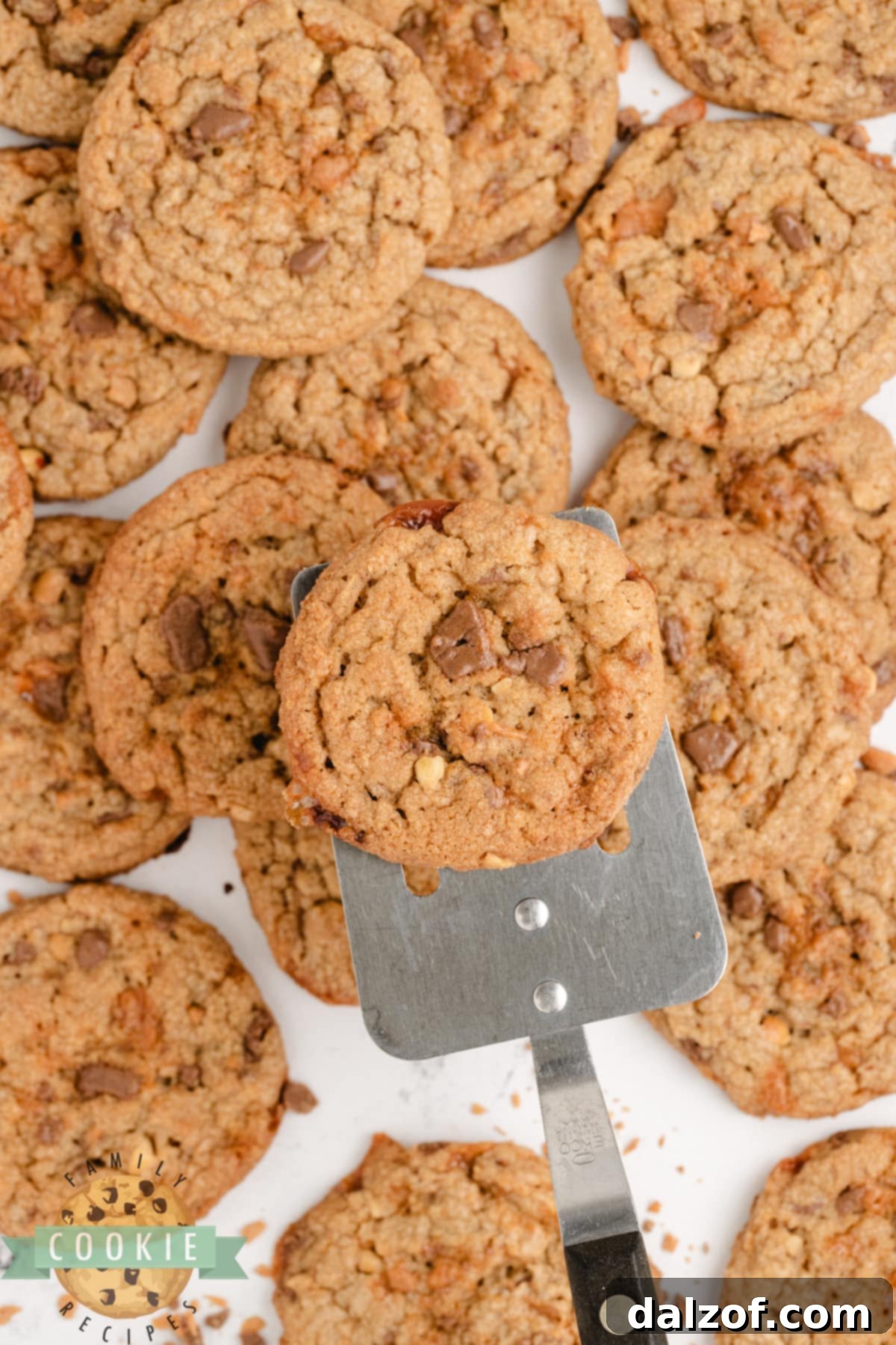 A stack of golden brown Butterfinger Peanut Butter Cookies, showcasing their soft texture and crunchy candy pieces.